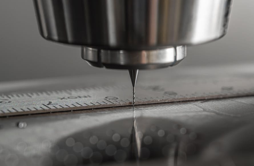 Detailed close-up of a CNC milling machine working on metal, showcasing precision and industry technology.